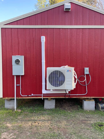 Condenser on the outside of a shed