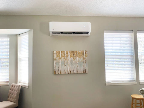 Wall unit above some wall art in-between two windows