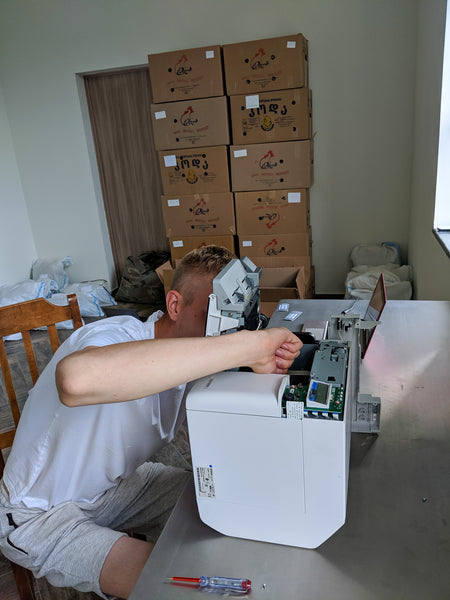 Mario doing a maintenance of the printer