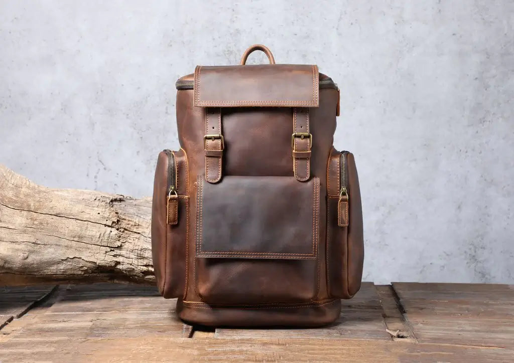 a travel brown genuine men's leather backpacks purse with adjustable straps, leather straps and easy access pockets