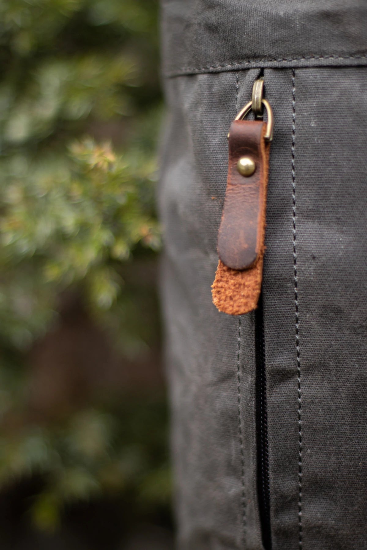 canvas and tanned leather backpack reinforced zipper pocket