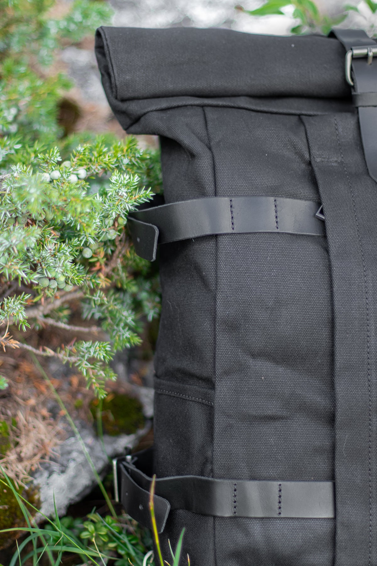 black leather straps hiking bag
