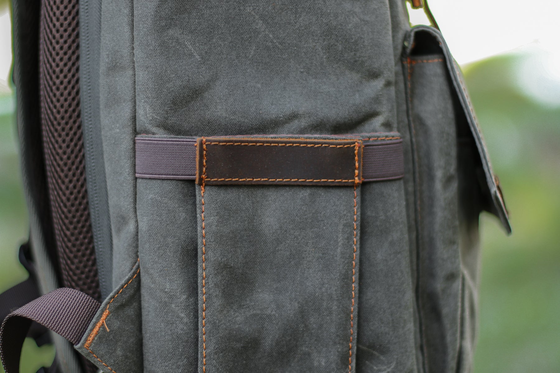 camera backpack side pocket to store a monopod, camera straps or accessories such as memory cards or chargers