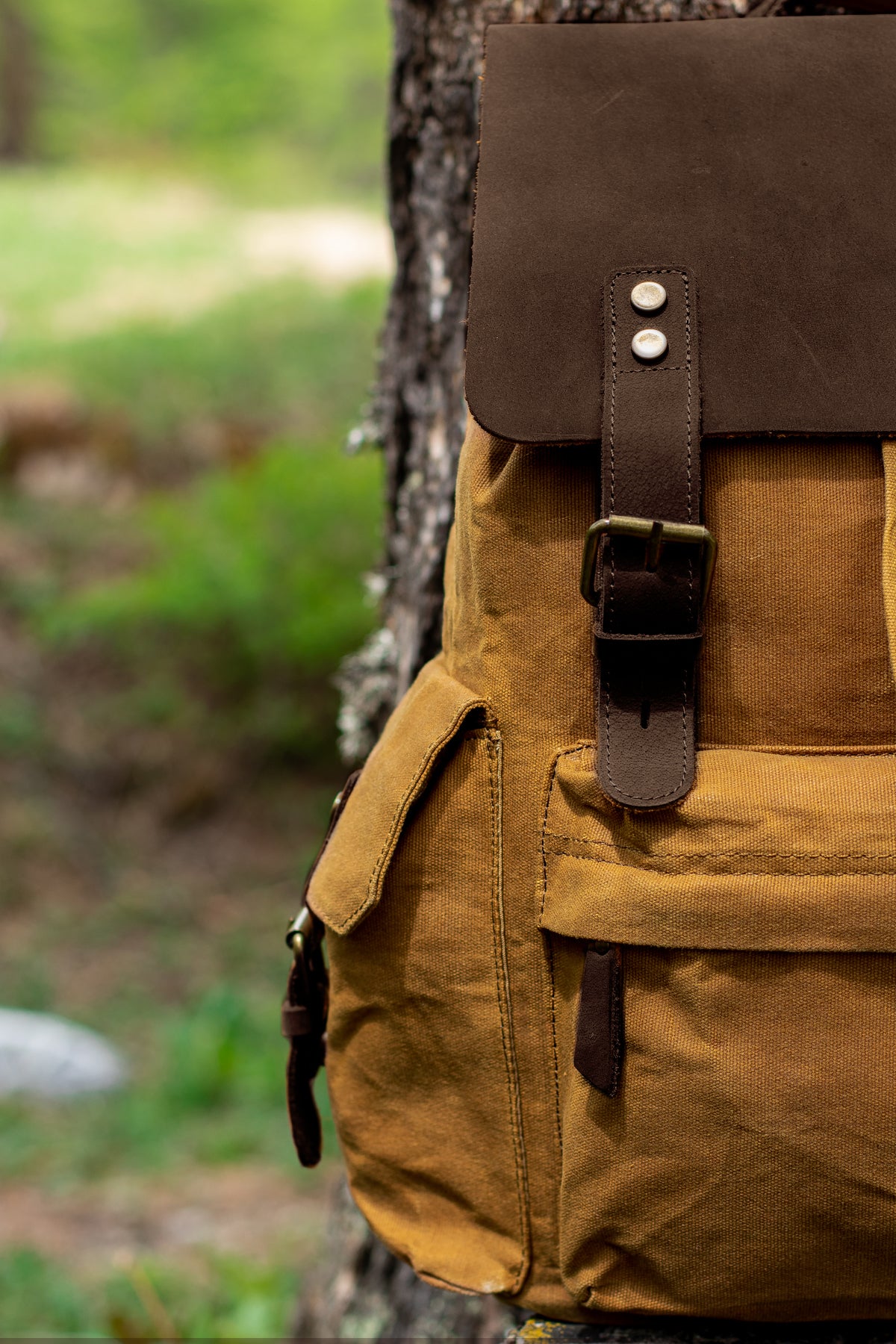 side pocket of the laptop waxed backpack for men and women