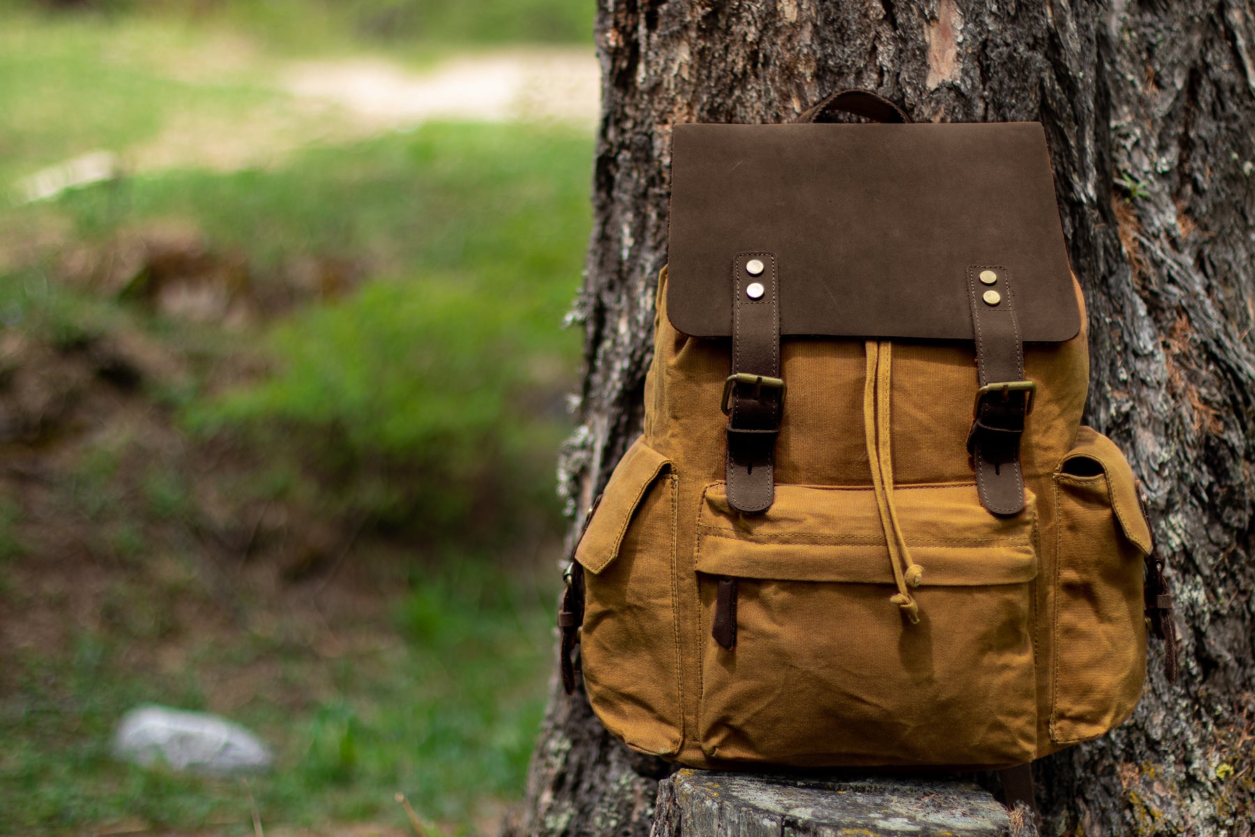 waxed backpack with exterior storage and interior pockets and laptop compartment