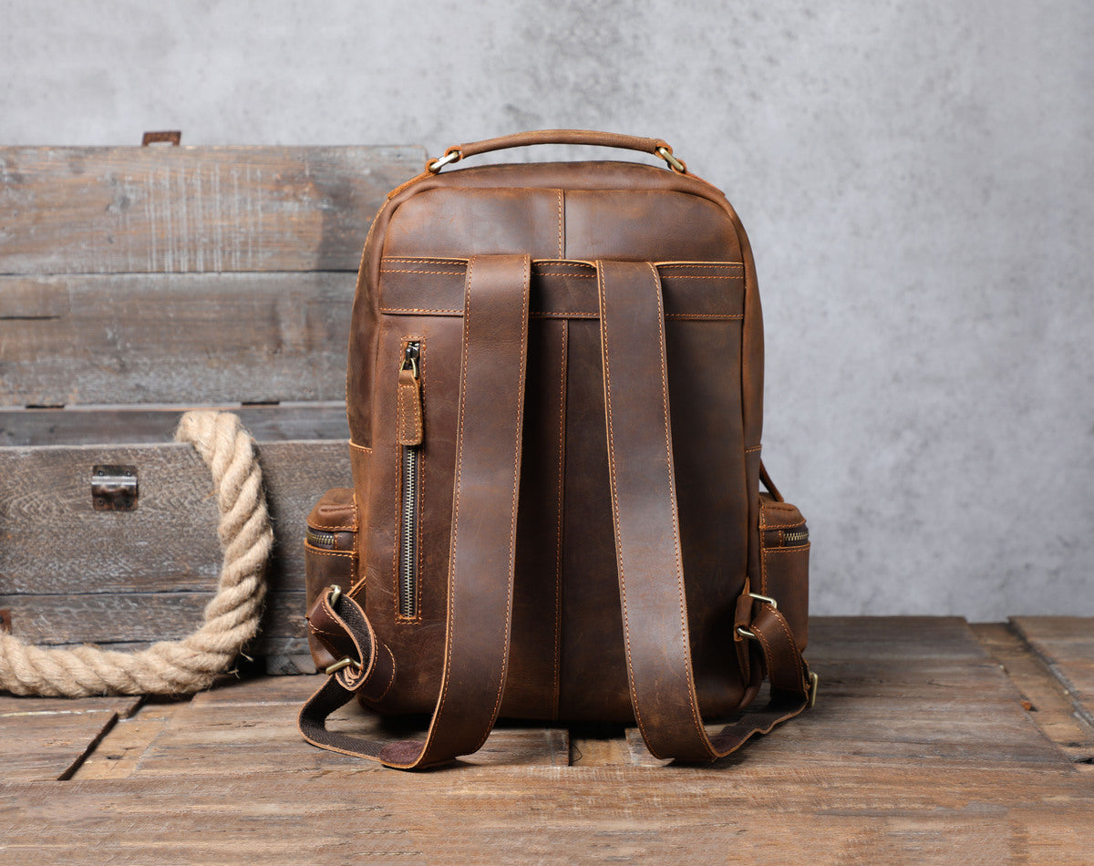 handcrafted ladies tanned leather backpack with adjustable strap and leather belts and shoulder-strap