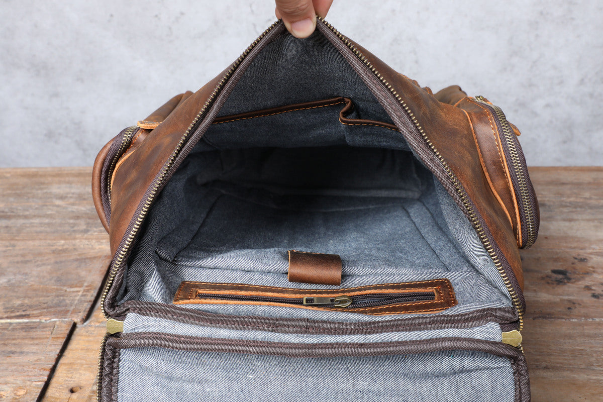 handcrafted tanned leather backpack with laptop compartment and zipped pocket to carry wallets, coin purse, card holder or sunglasses