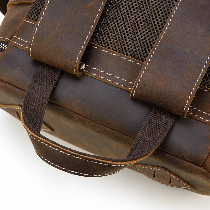 leather book-bag  with adjustable strap and leather belts and shoulder-strap