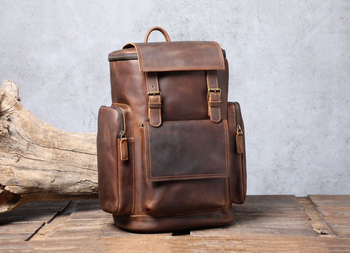 genuine leather laptop book-bag with adjustable strap and metallic buckle to protect your belongings