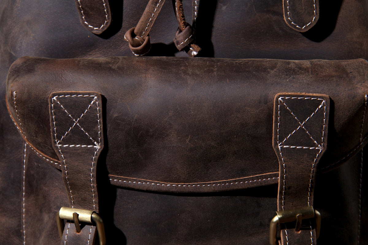 leather garment-bag rucksack with adjustable strap and leather belts and shoulder-strap
