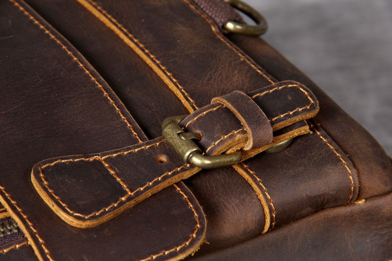 light tan leather carryall backpack with zipper pockets