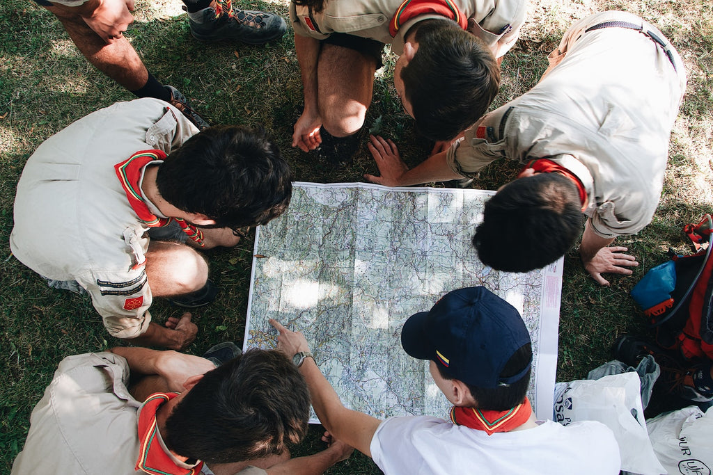 scouts looking at a map