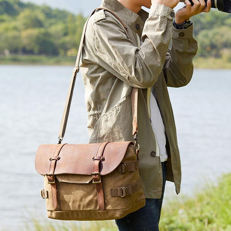 waterproof photo messenger bag with large pockets to carry clothes and a grab handle