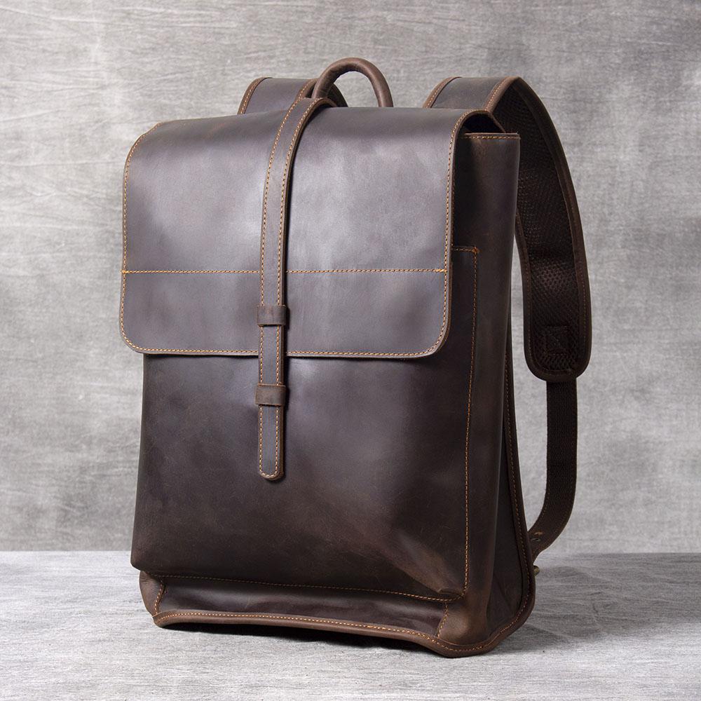 sleek distressed leather backpack with adjustable strap and leather belts and shoulder-strap