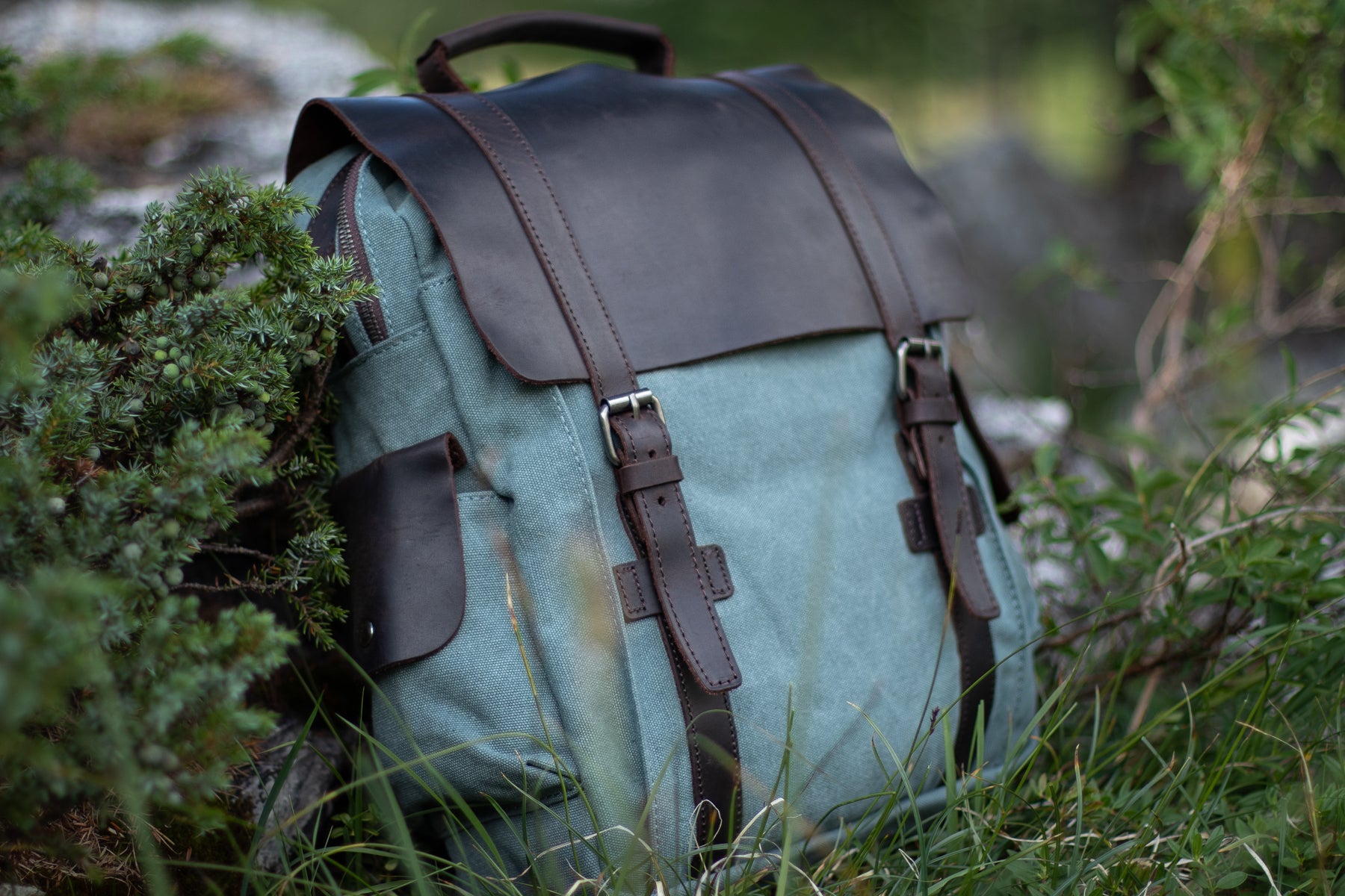 small waxed canvas laptop backpack with a sleek design and foam padding