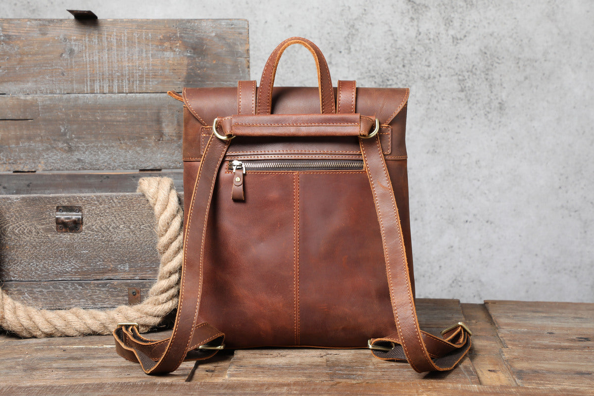 handcrafted small vintage leather backpack with smart side-pockets and anti-theft back pocket