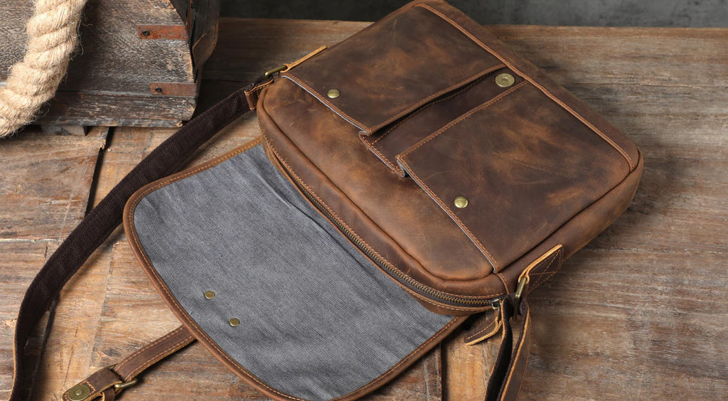 small vintage brown crazy horse leather messenger bag for men and women view of the bag's interior and comfortable shoulder strap