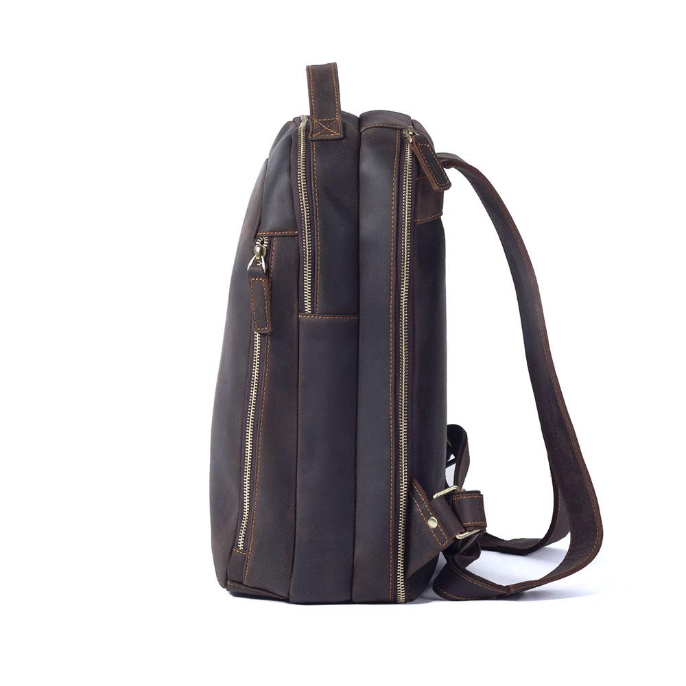 tan distressed leather backpack with adjustable strap and leather belts and shoulder-strap