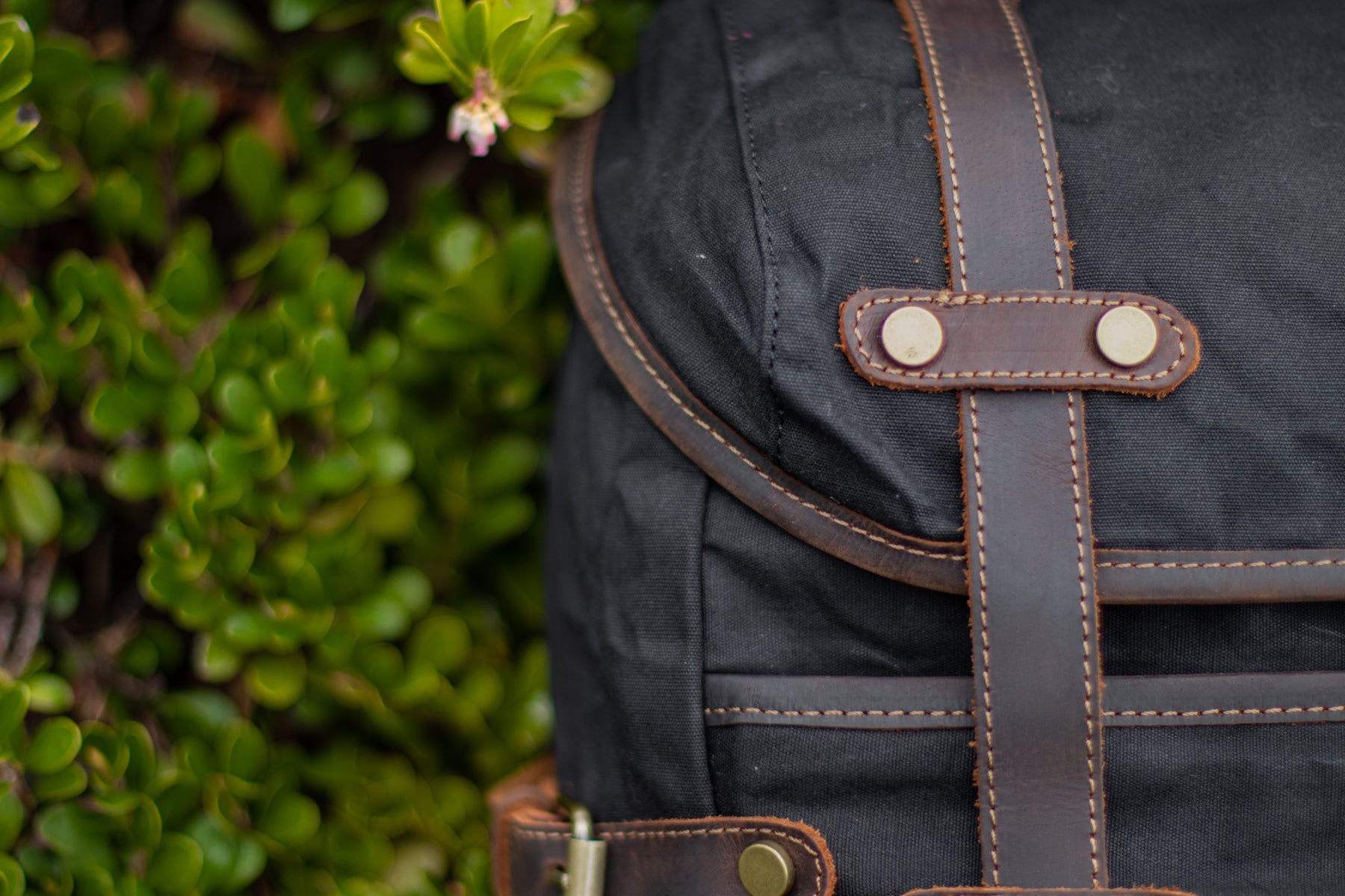 vintage style rucksack backpack with leather backpack traps and sturdy zippers, stitching and metallic buckle