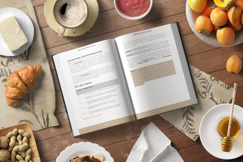 The 360Football nutrition guide, presented as an open book between cooking ingredients in a kitchen.