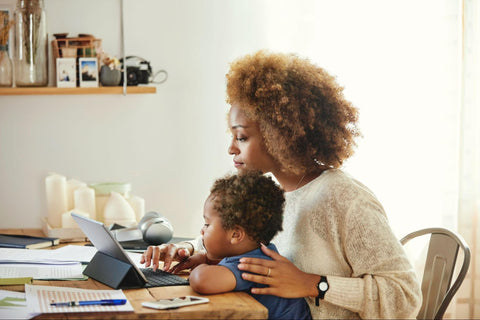 Woman and child looking at laptop