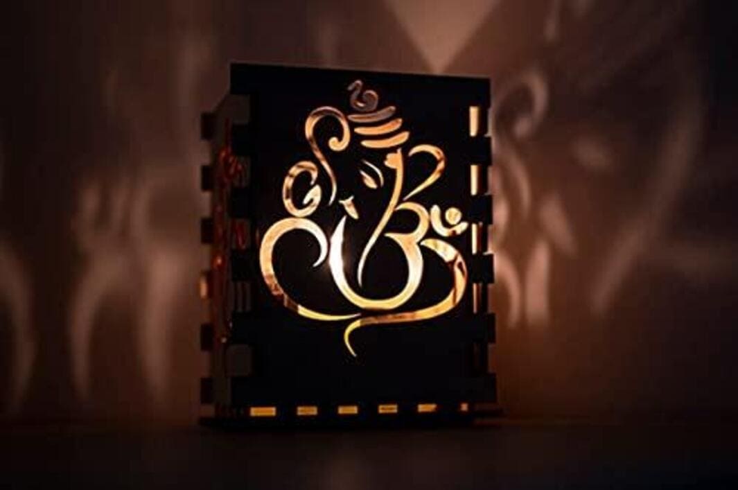 Buy Wooden candle holder with Ganesh s for glass enclosed candle. – Hapuka