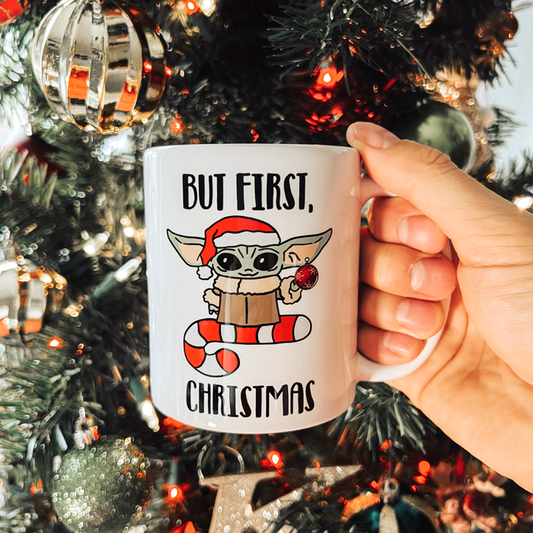 https://cdn.shopify.com/s/files/1/0135/7666/7193/products/Baby-Yoda-But-First-Christmas-11oz-3.png?v=1639168991&width=533