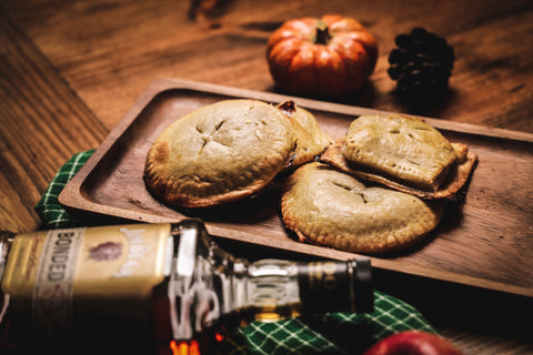 Pumpkin and Apple Hand Pies with a bottle of Jim Beam Bottled in Bond