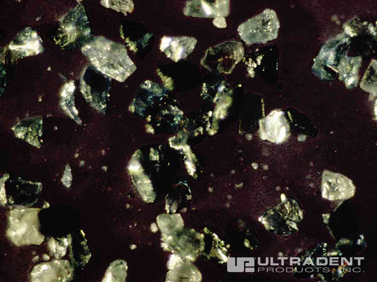 Silicon carbide microparticles contained in Opalustre abrasion slurry.