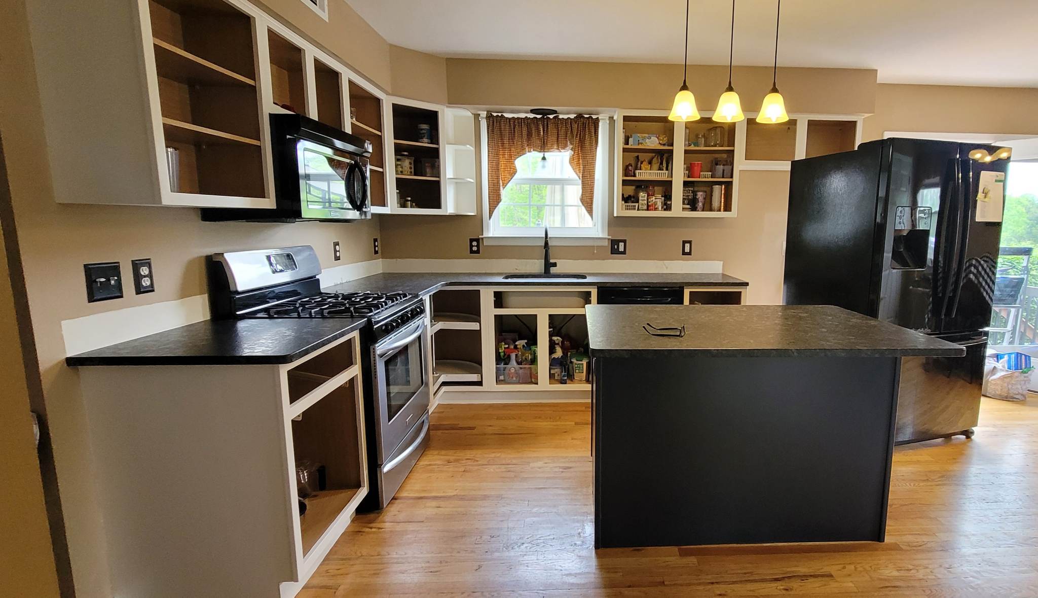 Elevating Your Home with Grace on Broadway Cabinet and Furniture Refinishing Featuring a Kitchen Refinished in White Wood Coating During Refinishing