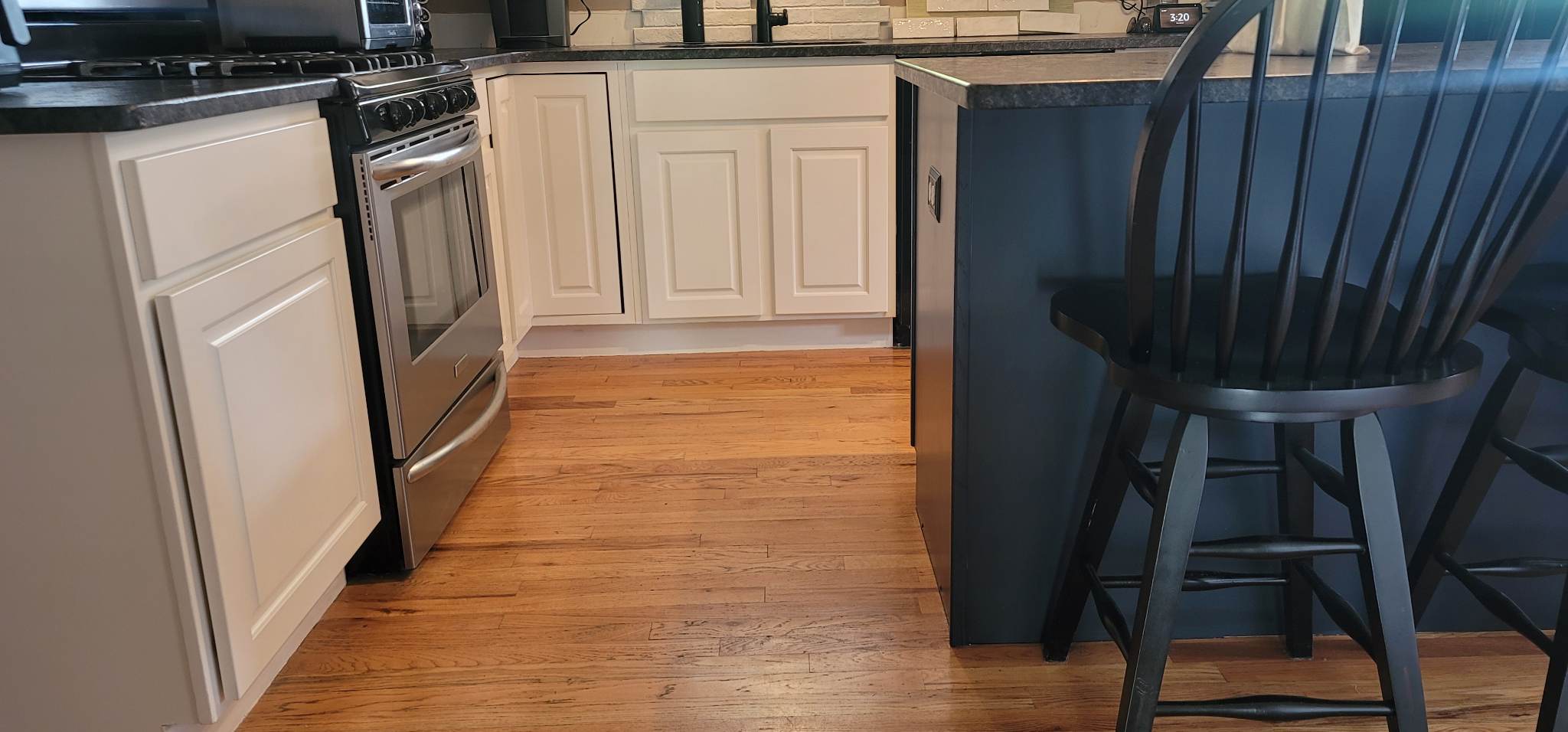 Elevating Your Home with Grace on Broadway Cabinet and Furniture Refinishing Featuring a Kitchen Refinished in White Wood Coating After Refinishing