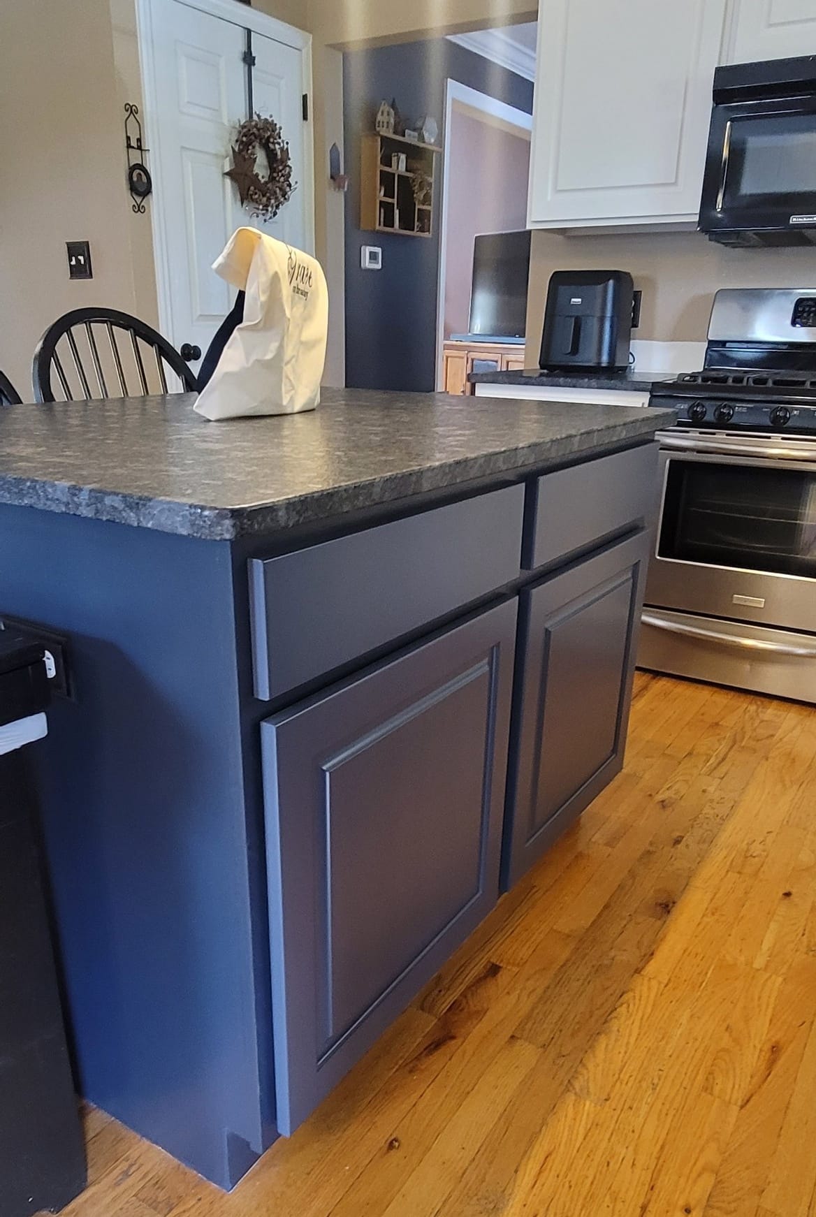 Elevating Your Home with Grace on Broadway Cabinet and Furniture Refinishing Featuring a Kitchen Refinished in White Wood Coating After Refinishing