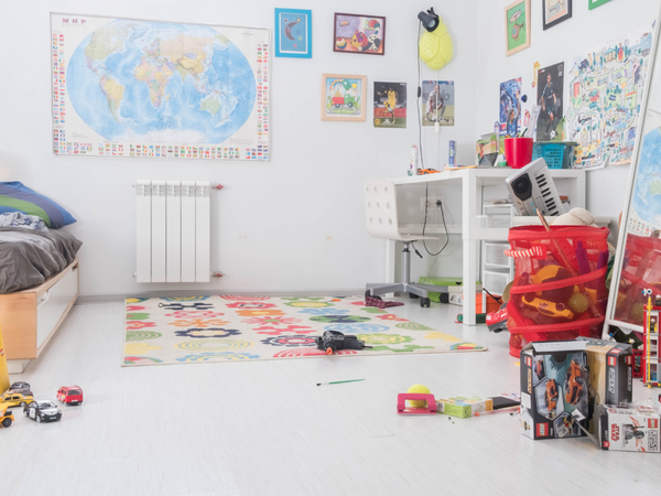 Photo of a room with toys and other items strewn about