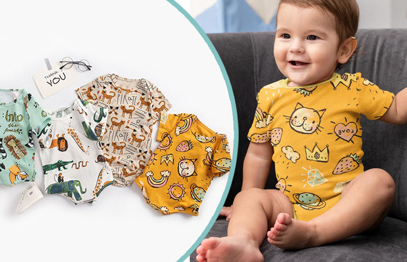 Image of a happy baby boy wearing Organic Bamboo Animal Romper 4 Pieces
