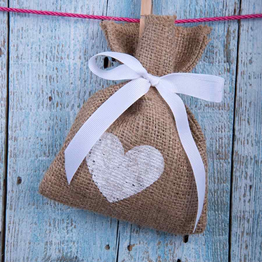Adorable heart-shaped burlap pouch to keep your keepsake jewelery safe.