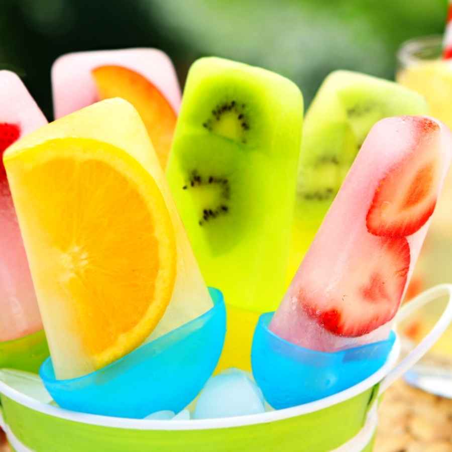 Delicious orange and lemonade fruit popsicles, perfect for a hot summer day.