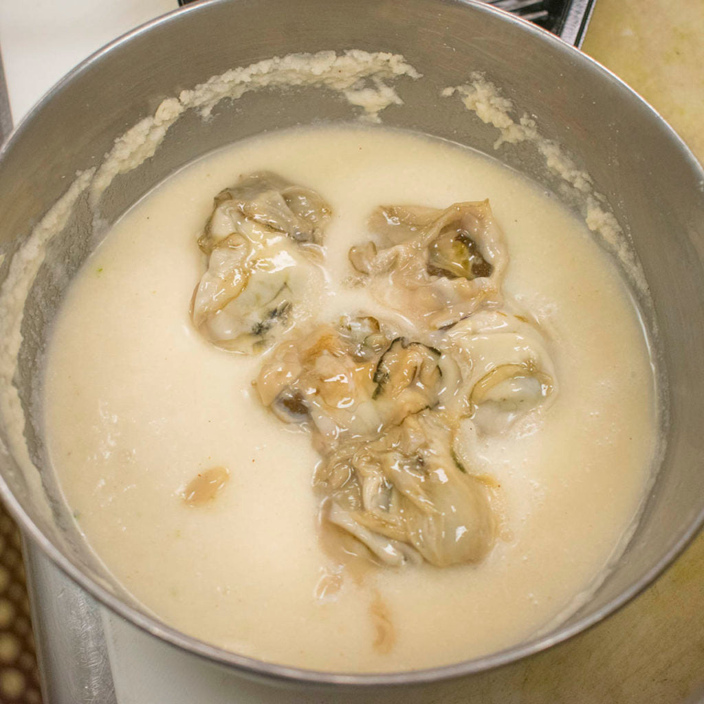 Dip each oyster into the batter, letting excess drip off