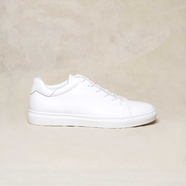 all white leather athletic shoes