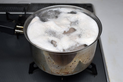 Boiling bound pork chashu in water