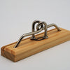 Mr. Puzzle AU Puzzles Bent Again metal nail puzzle on wood stand