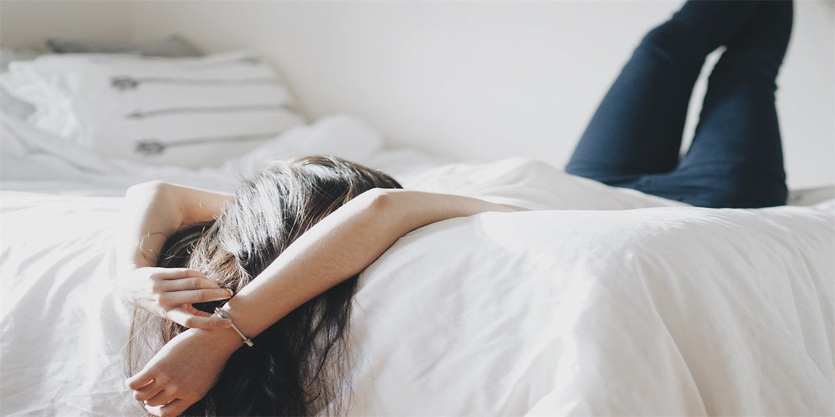 woman lying on bed