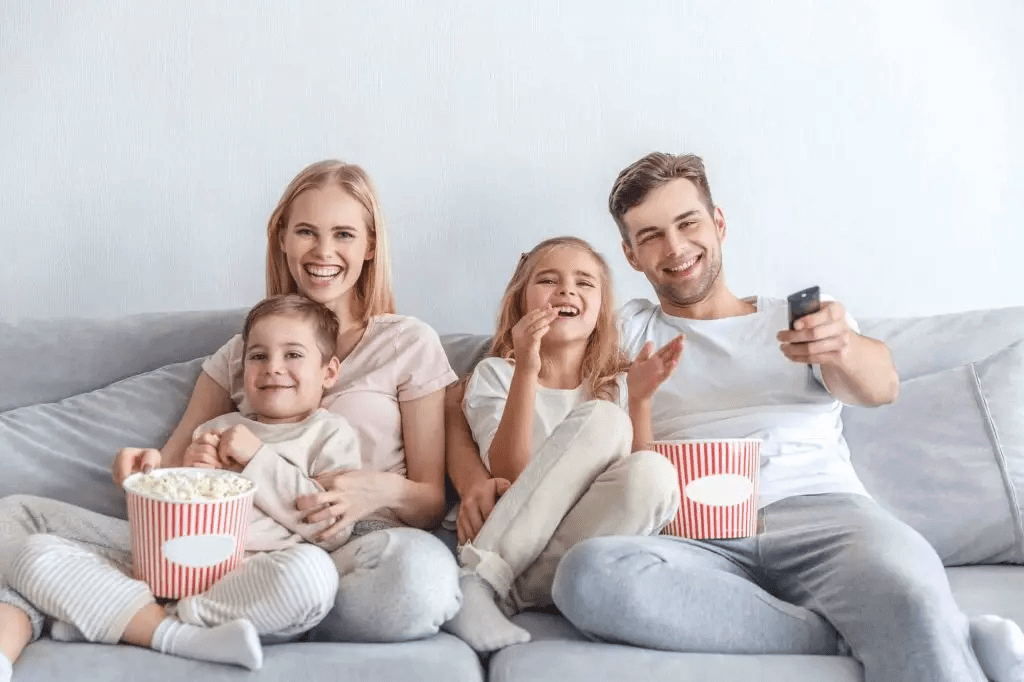 family laughing eating popcorn destress techniques