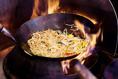 frying noodle on a wok