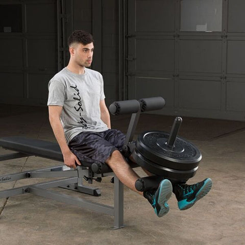 Body-Solid Powercenter Rack Bench Combo GDIB46L Strengthen, tone, and develop your knee, thigh, hamstring, and glute muscles with the six-roller Leg Extension / Leg Curl Station included with the PowerCenter Combo Bench.