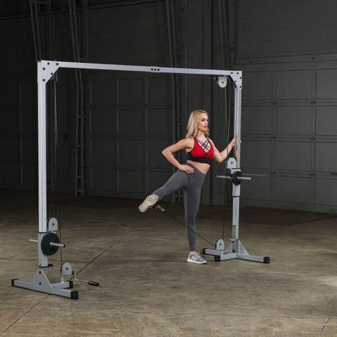Body-Solid Powerline PCCO90X Cable Crossover Machine- Includes two cable handles and one ankle strap.