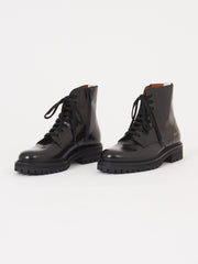 woman by common projects combat boots