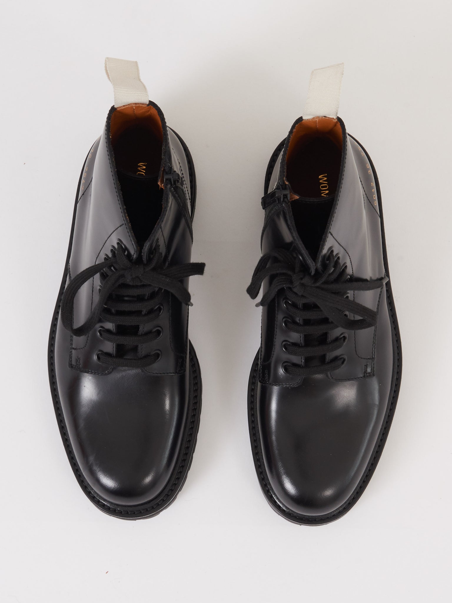 woman by common projects combat boots
