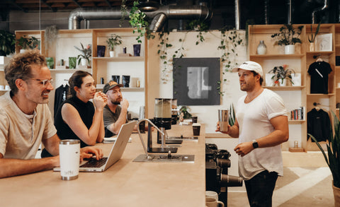 MUD\WTR founder Shane Heath enjoys a beverage with coworkers