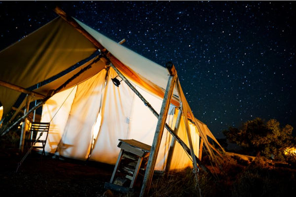 glamping tent underneath night sky stars