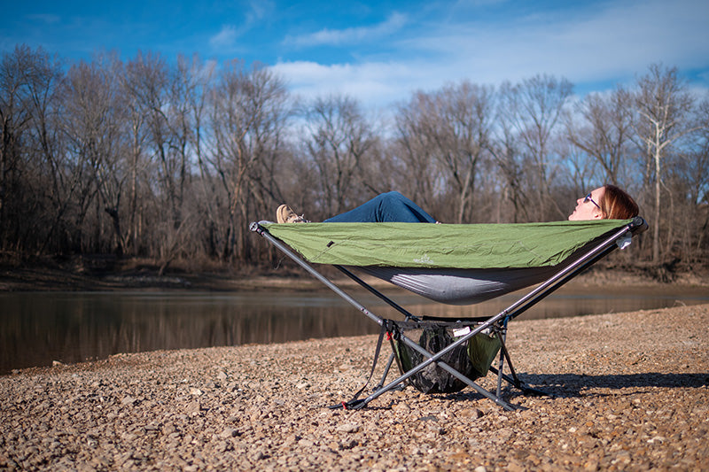 lakeside camping with free standing portable hammock